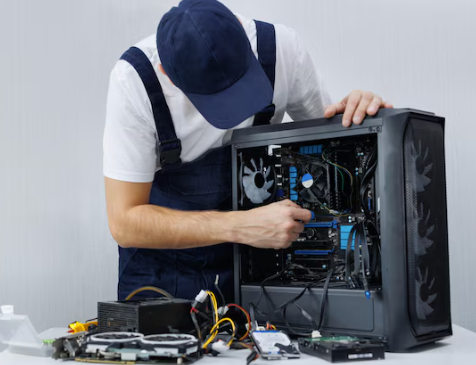 On-site uniformed technician working at a PC