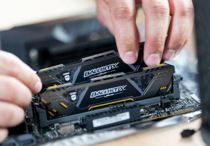 Technician upgrading computer RAM
